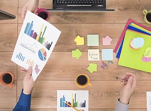 product6 Business team analyzing financial data on a meeting